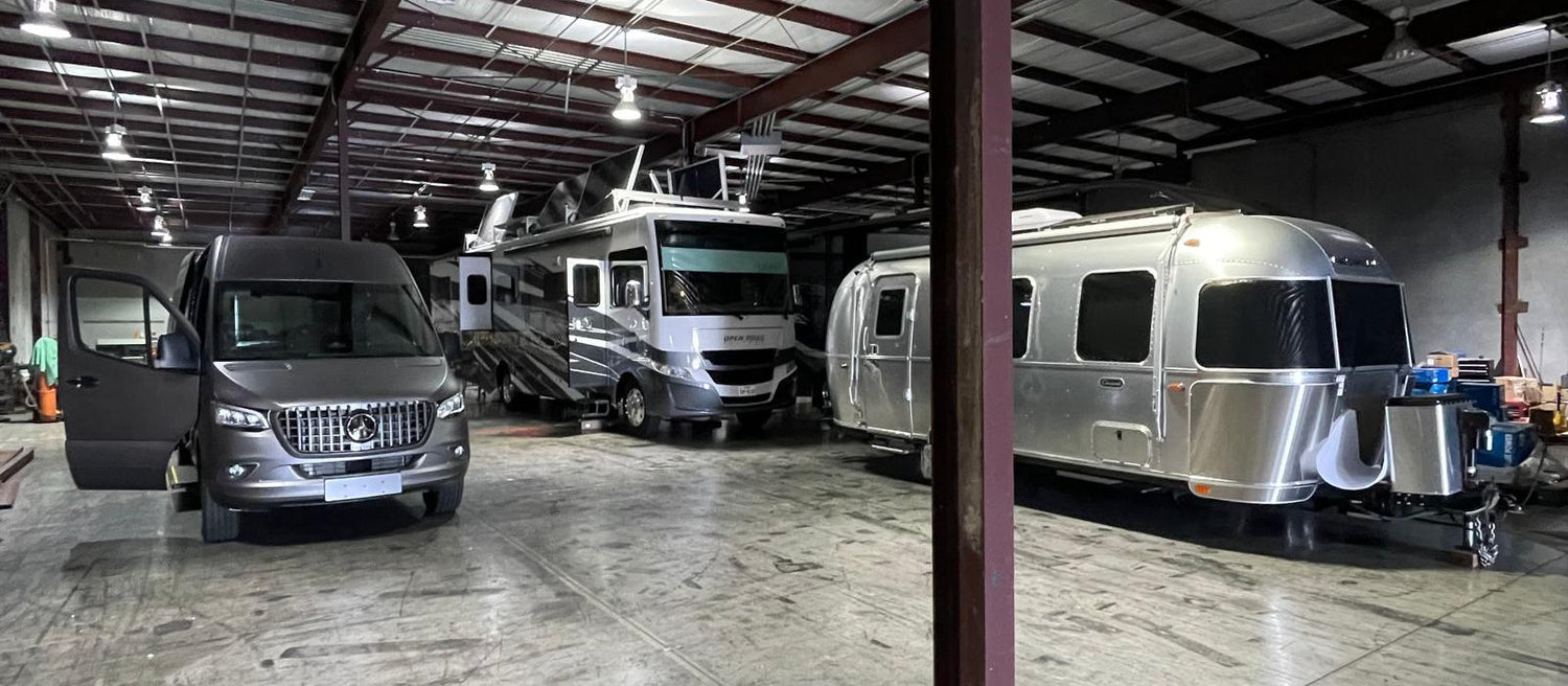 Jonsson Tech shop in Houston with a Sprinter van, Class A motorhome and two Airstreams in for power system work